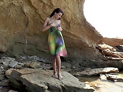 Solo pretty teen model Kate Rich rides a dildo at the beach