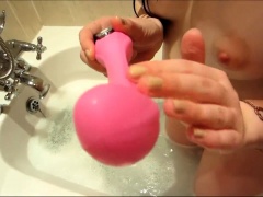 Stacked teen fucks her peach with a pink toy in the shower