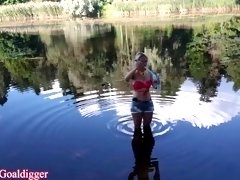 Girl in glasses blowing bubbles on the river. Full clip in Fan Club