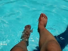 Feet in the pool with a lot of water