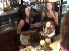 Two sensual babes fucked rough by a group of guys in a bar